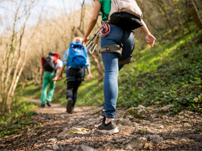 Young people hiking on a woodland trail