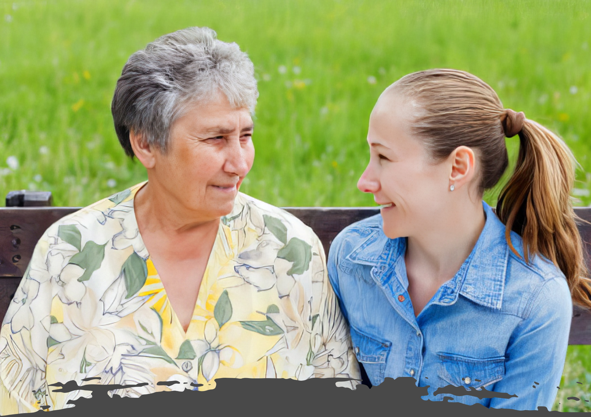 Young woman sitting on a bench with an older woman, both smiling and engaged in conversation outdoors