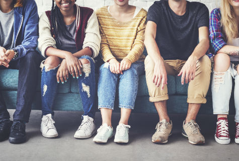 Young people sitting on a sofa