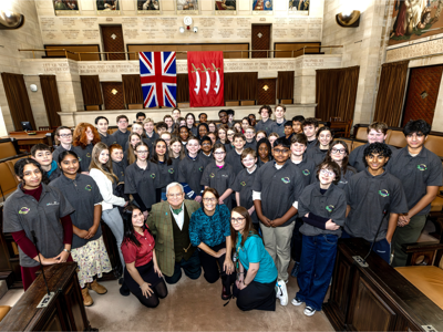 Young Essex Assembly members in a council chamber