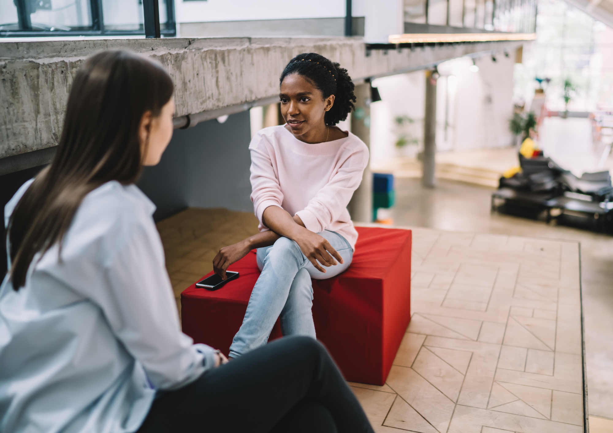 Two young people in a mentoring conversation