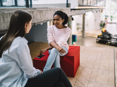 Two young people in a mentoring conversation