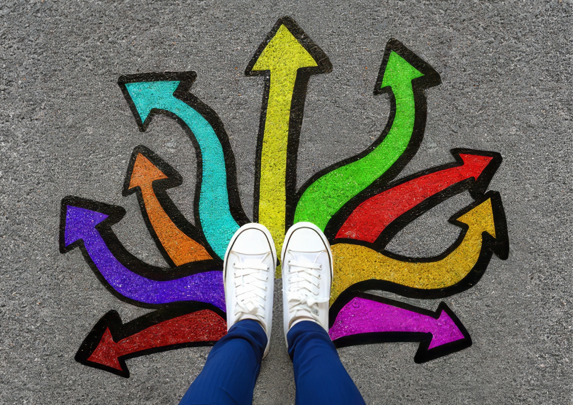 Person standing beside colourful direction arrows