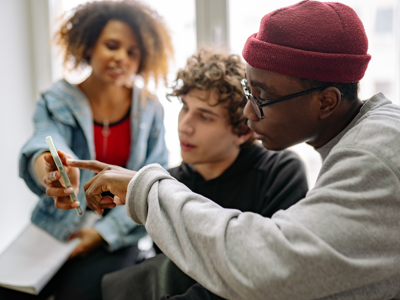 Young people looking at a smartphone together