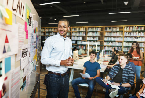 young people sitting at a round table in discussion